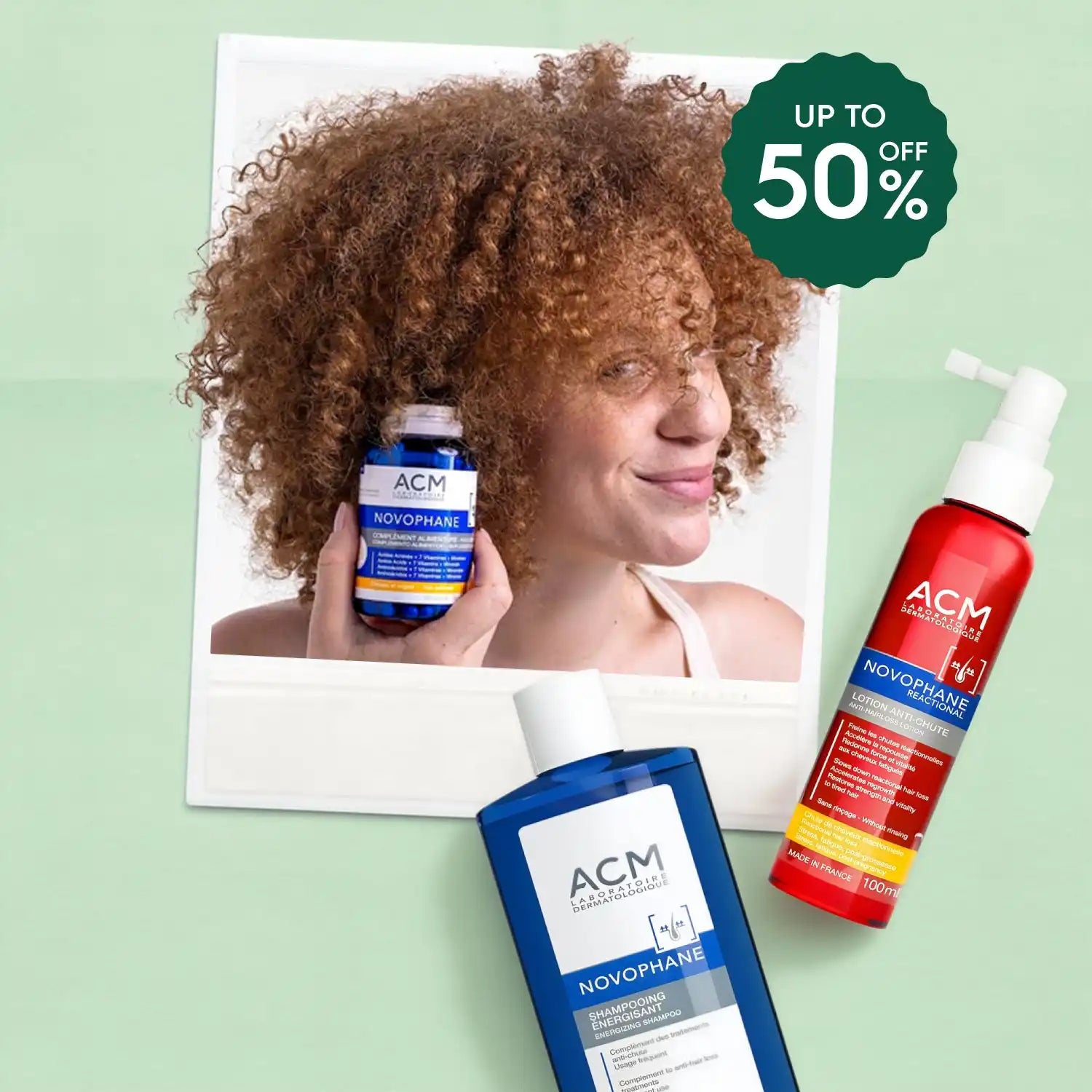 A woman with curly hair holding a bottle of hair care product, with two other hair care products visible.
