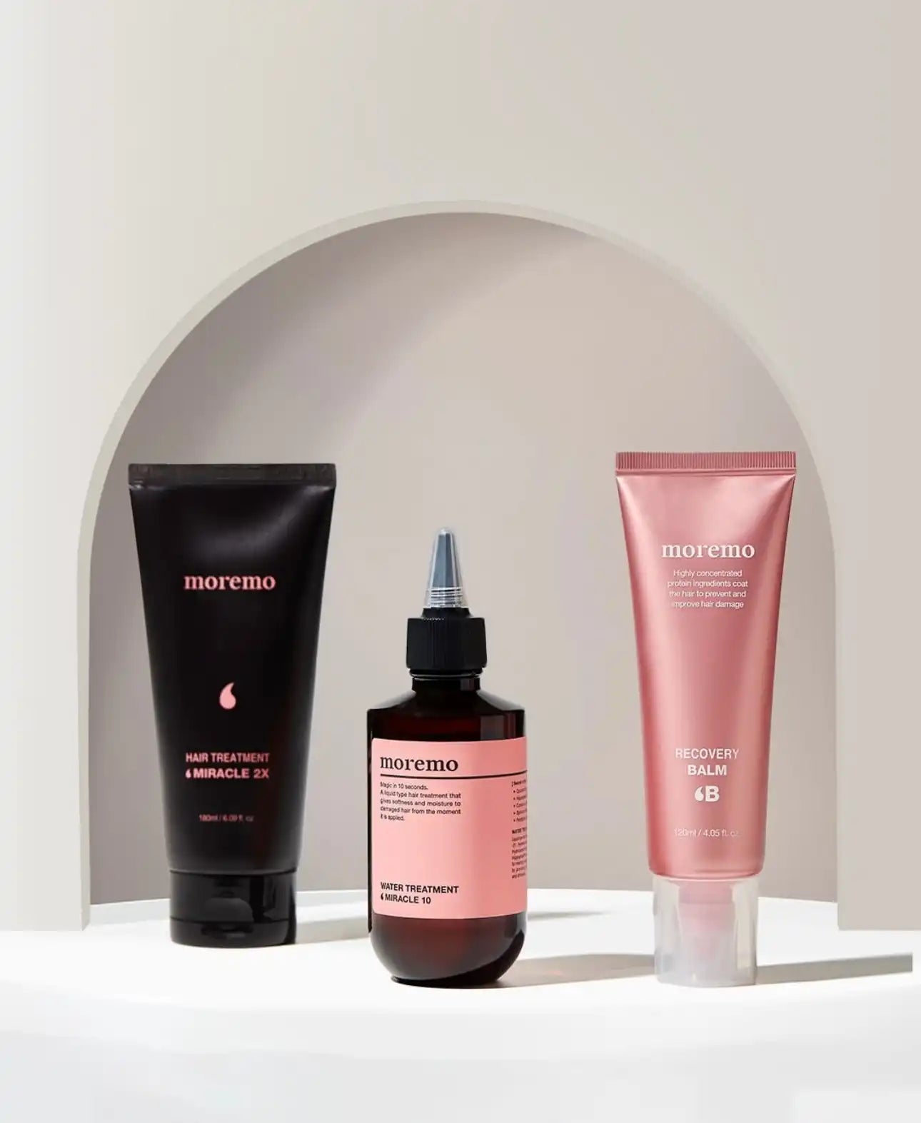 Three hair product containers.