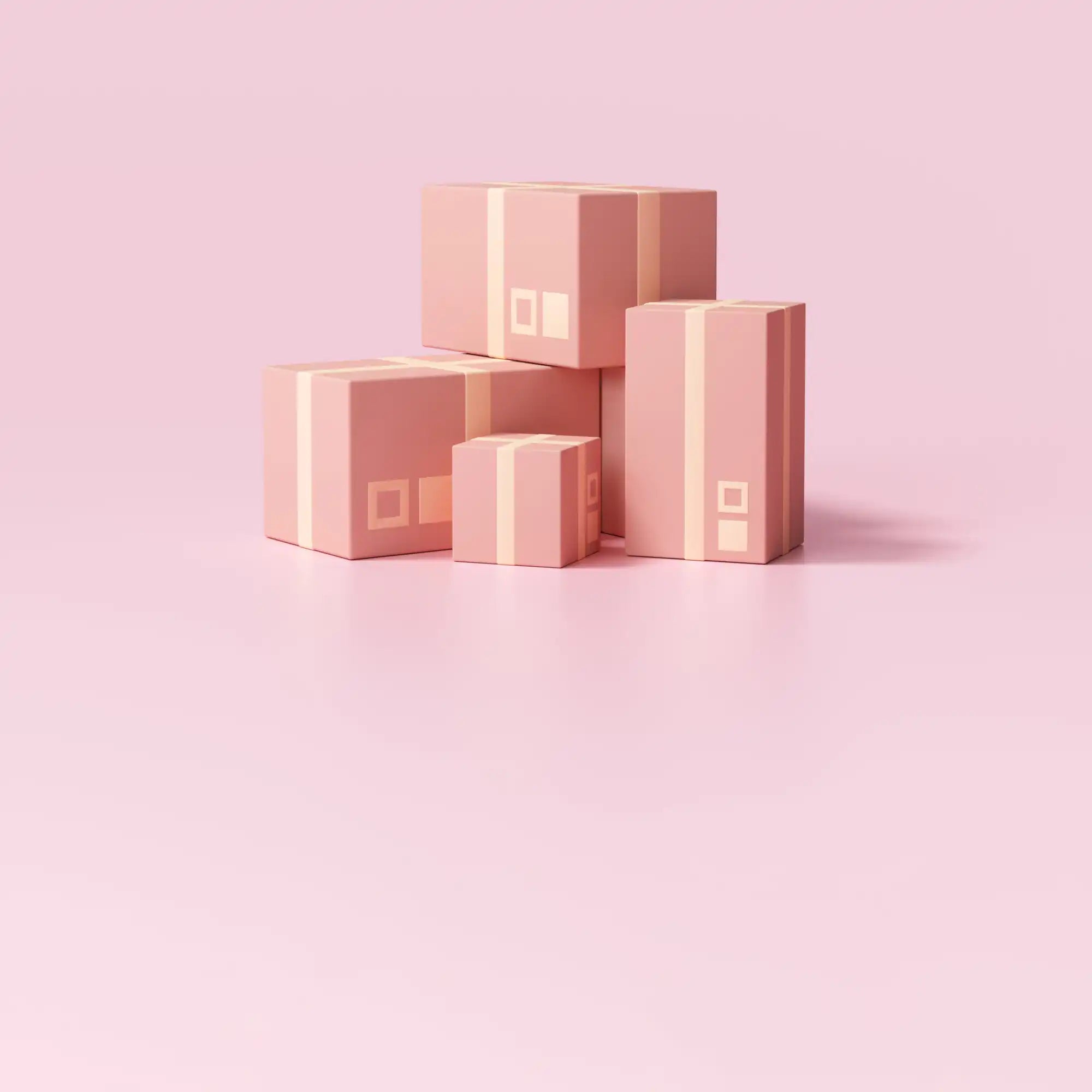 A collection of several closed pink cardboard boxes with light pink tape.