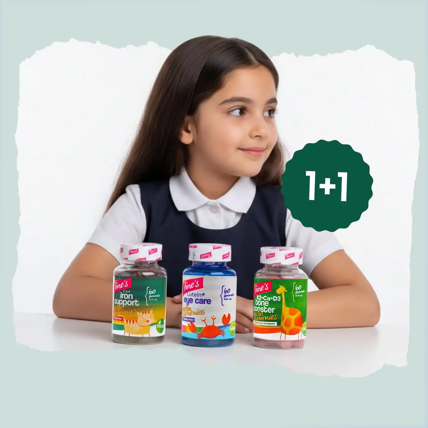 Young girl with three bottles of children’s vitamins.