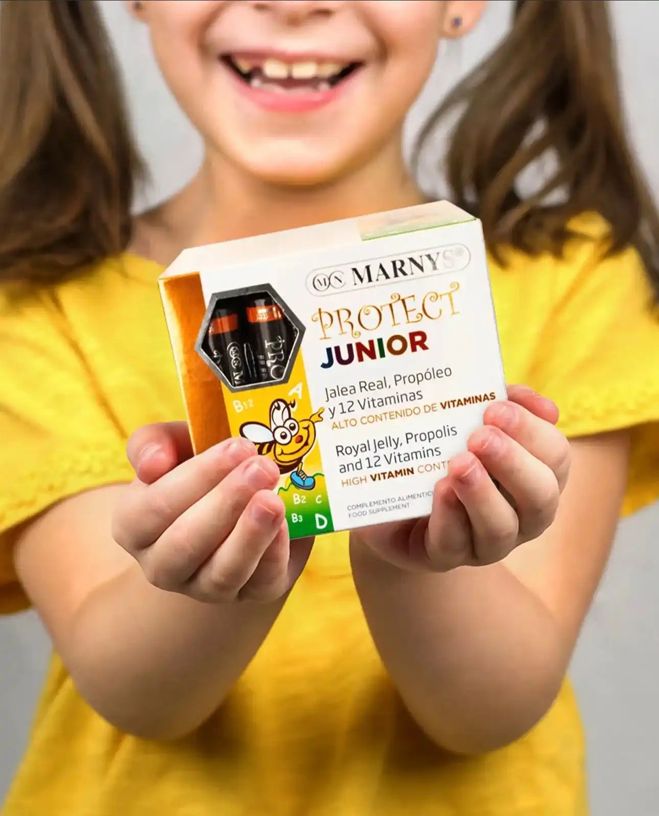 A box of children’s dietary supplements containing royal jelly, propolis, and 12 vitamins.