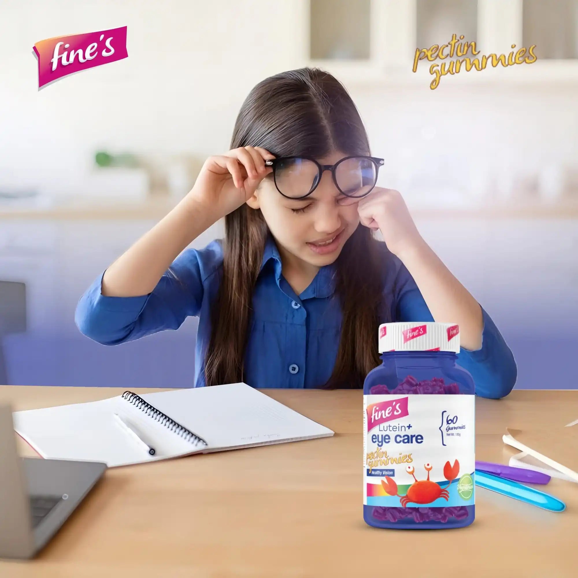 A purple bottle of Fine’s Lutein+ eye care gummies for children, featuring a crab and seashell design.