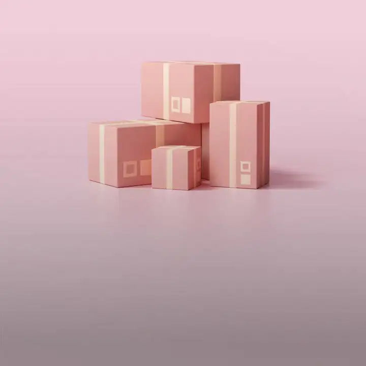 Stack of blush pink cardboard boxes with cream-colored tape and minimalist white square logos.