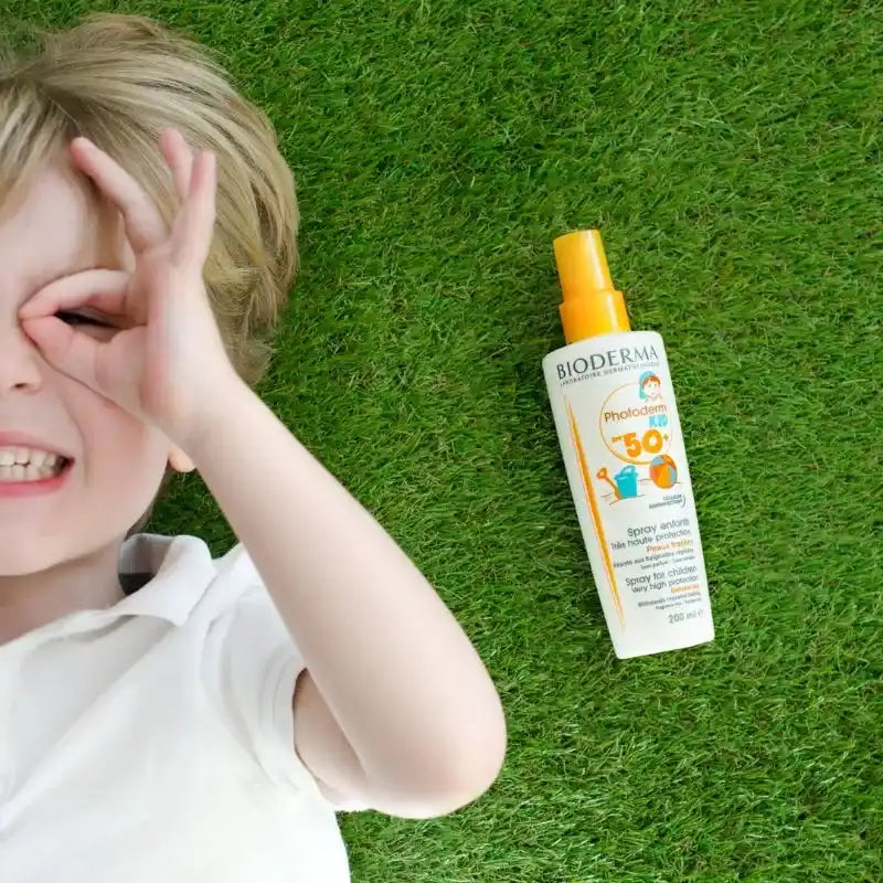 A bottle of children’s SPF 50 sunscreen spray.