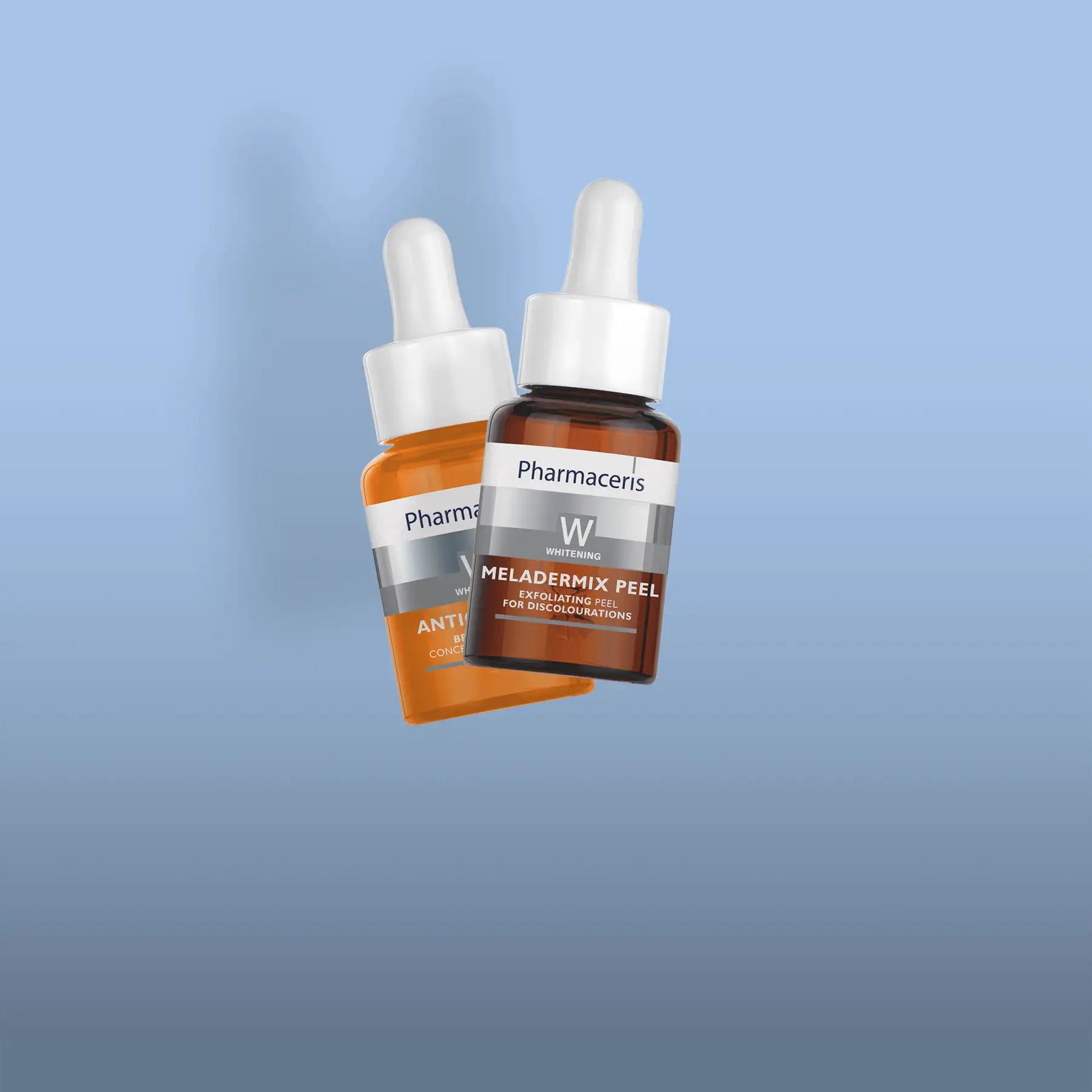 Two amber glass dropper bottles with white caps and silver labels, branded as pharmaceris meladermix peel.