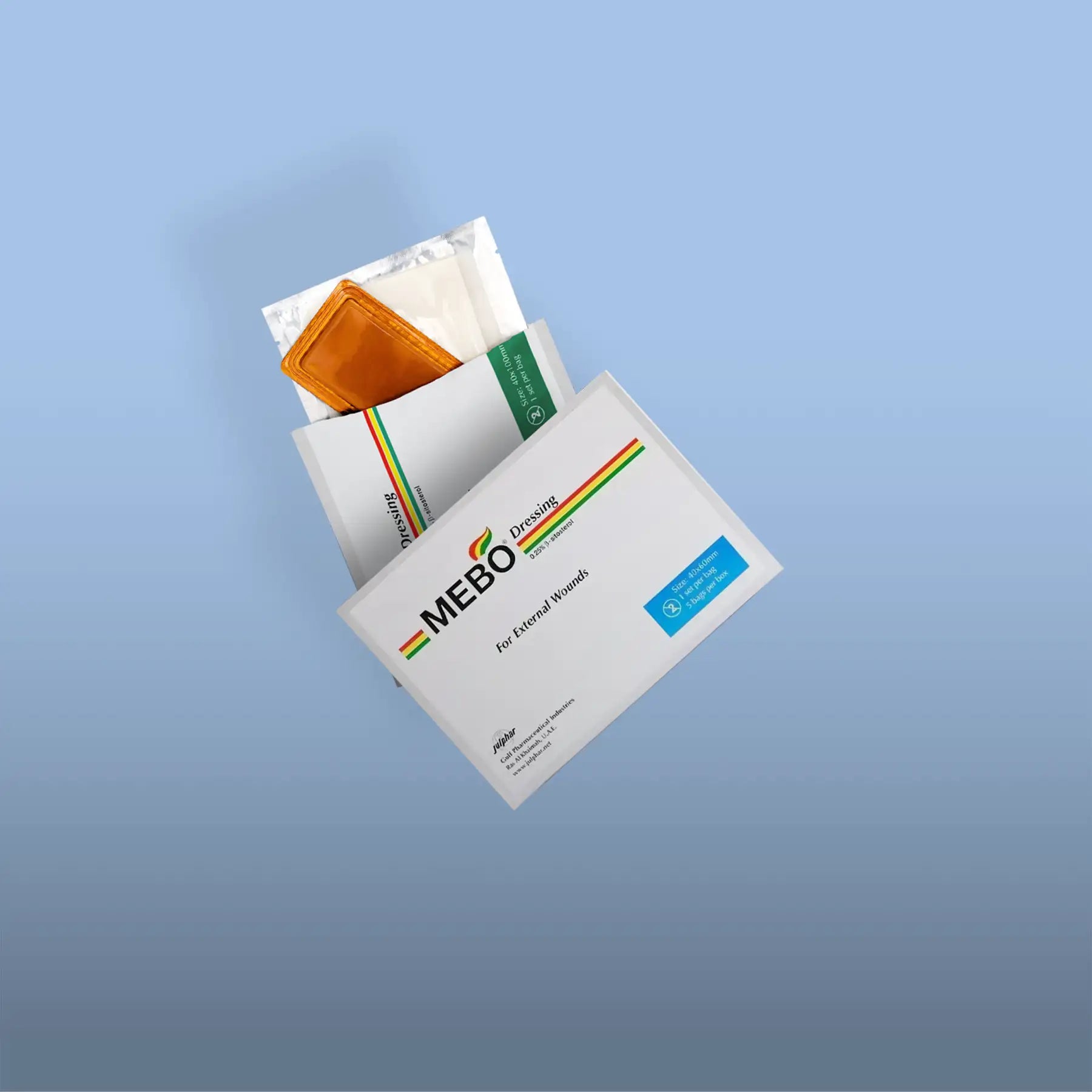 White rectangular package of mebo brand dressing for external wounds, featuring a green and orange stripe design with visible amber-colored adhesive bandage inside.