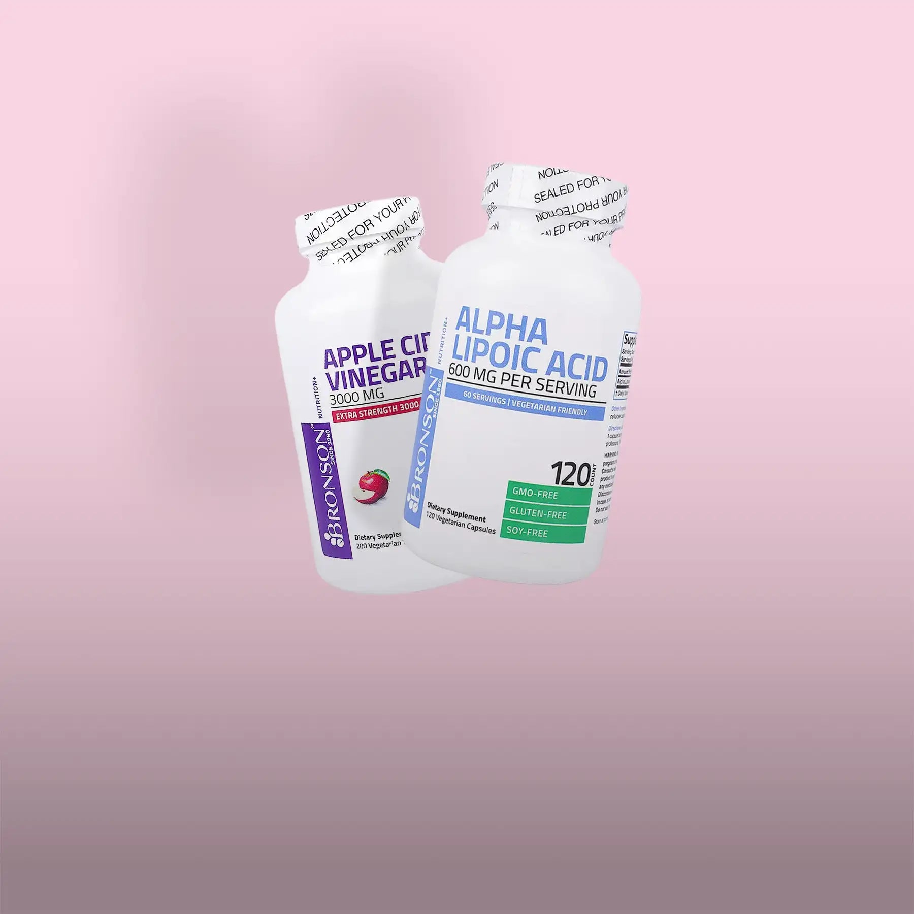 Two white plastic supplement bottles, one labeled ’apple cider vinegar 3000 mg’ and the other ’alpha lipoic acid 500 mg per serving,’ both from bronson.