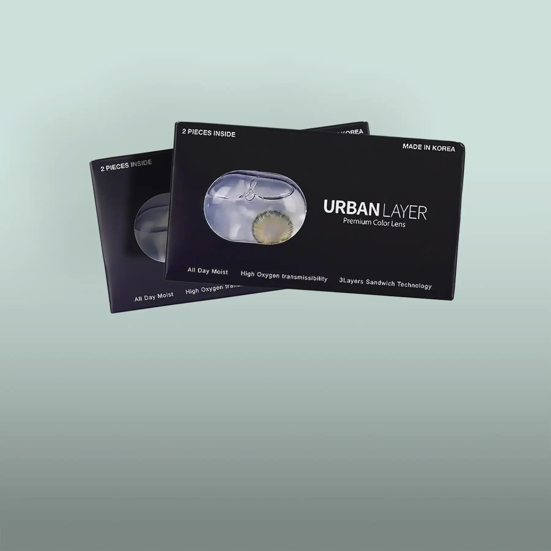 Black rectangular packaging for urban layer premium color lenses, featuring a clear window displaying the lenses inside.