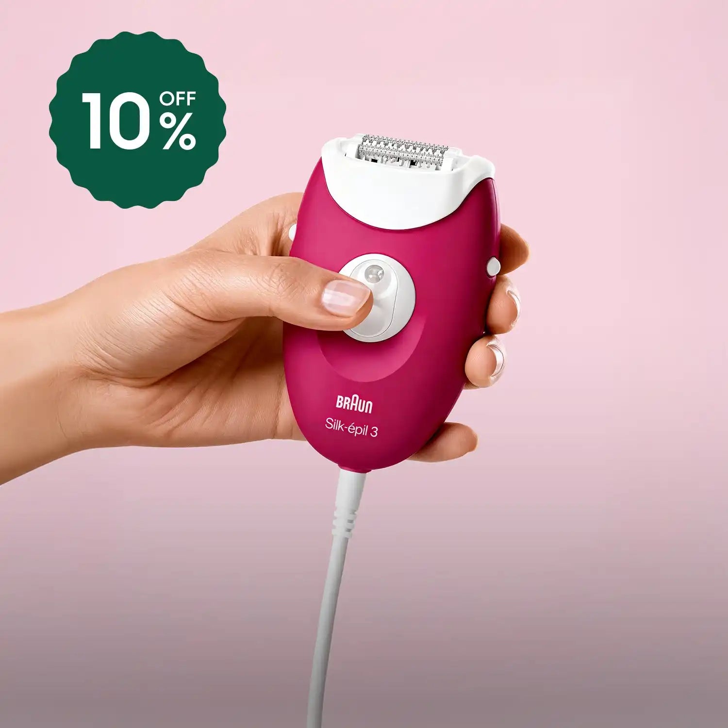 Pink braun epilator with white cord and button design.