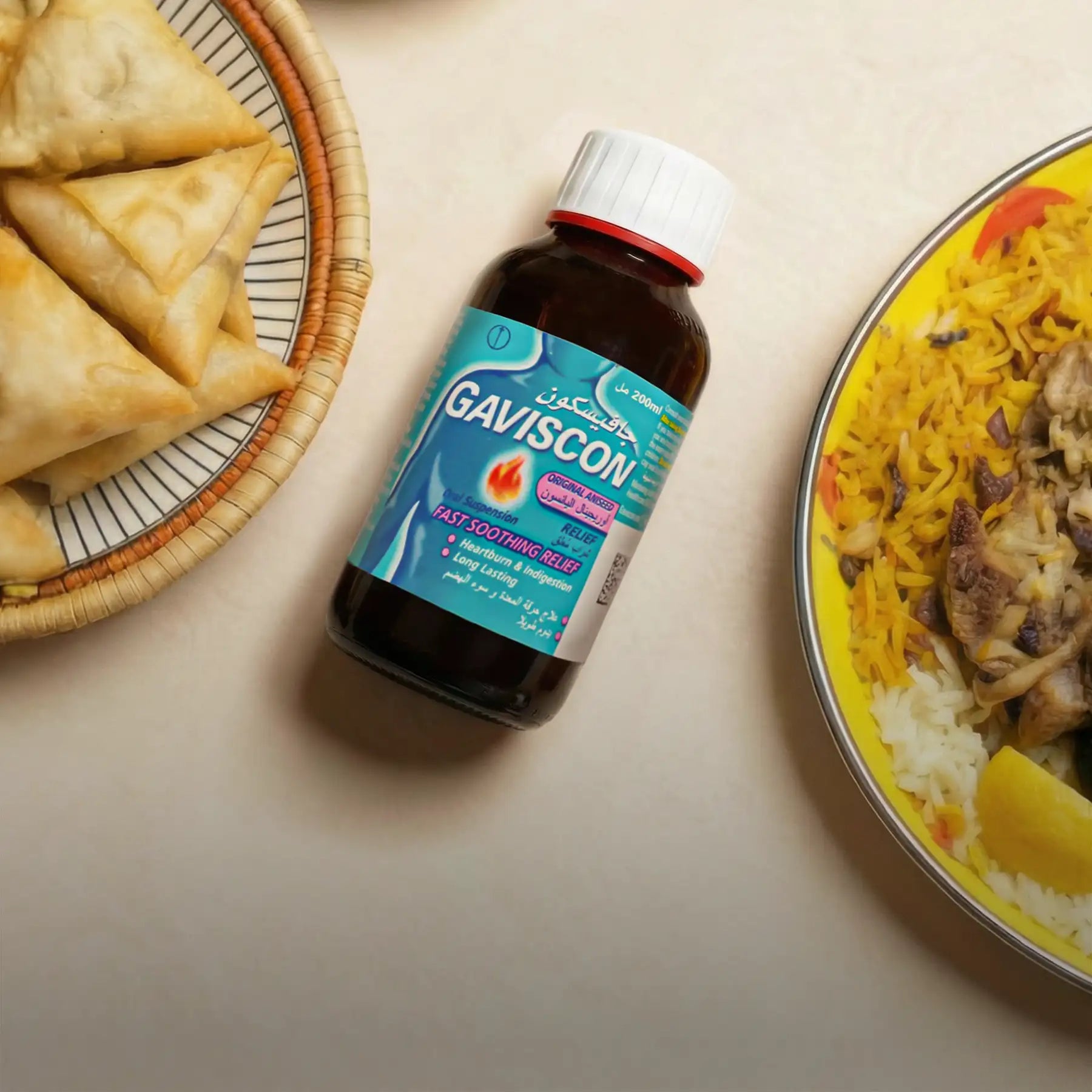 A dark brown glass bottle of gaviscon original relief with a white cap and teal label featuring arabic text, positioned between two plates of food.