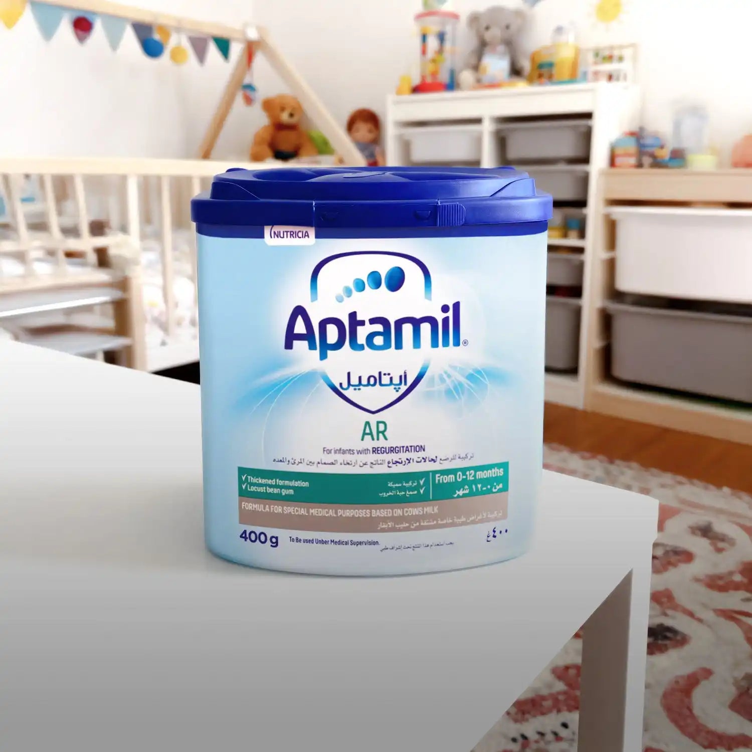 Aptamil ar baby formula container, 400g, blue and white label.