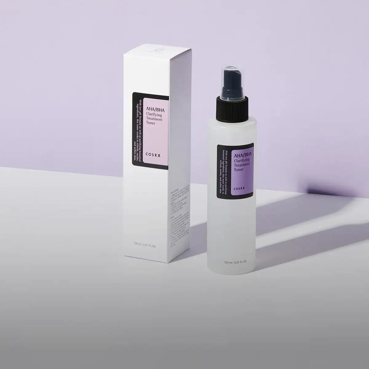 A sleek white spray bottle with a black nozzle and label, featuring the cosrx aha/bha clarifying treatment toner.