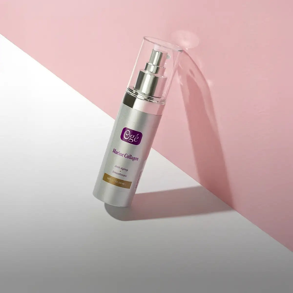 Silver oge marine collagen serum bottle with a clear spray nozzle and purple branding on the label.