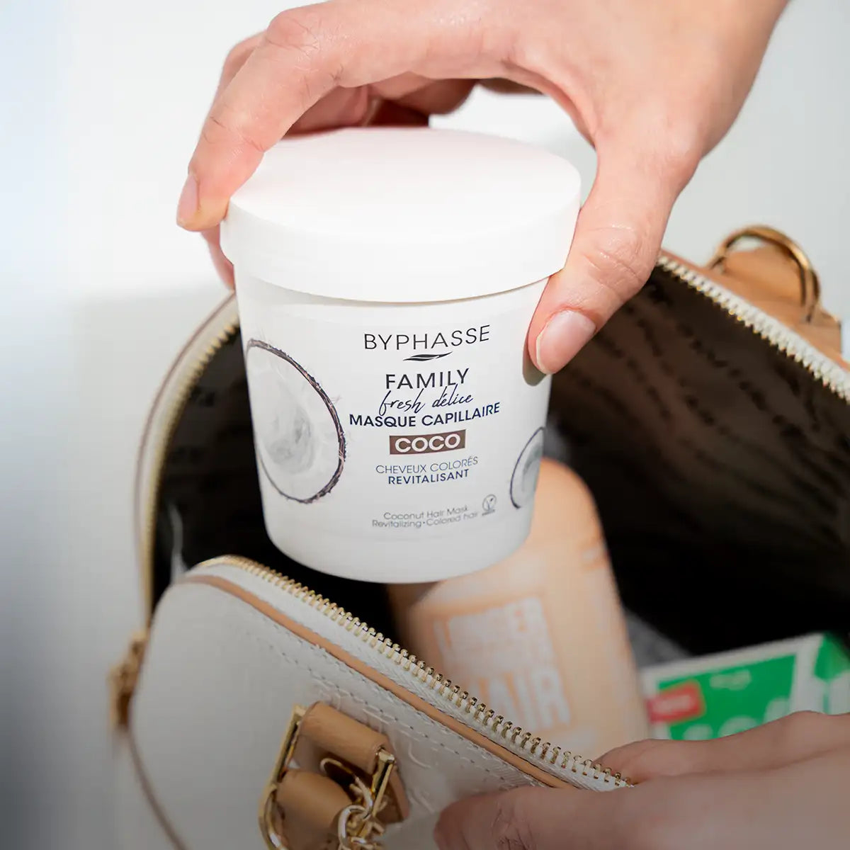 White cylindrical container of biphasse family fresh delice coco coconut hair mask.