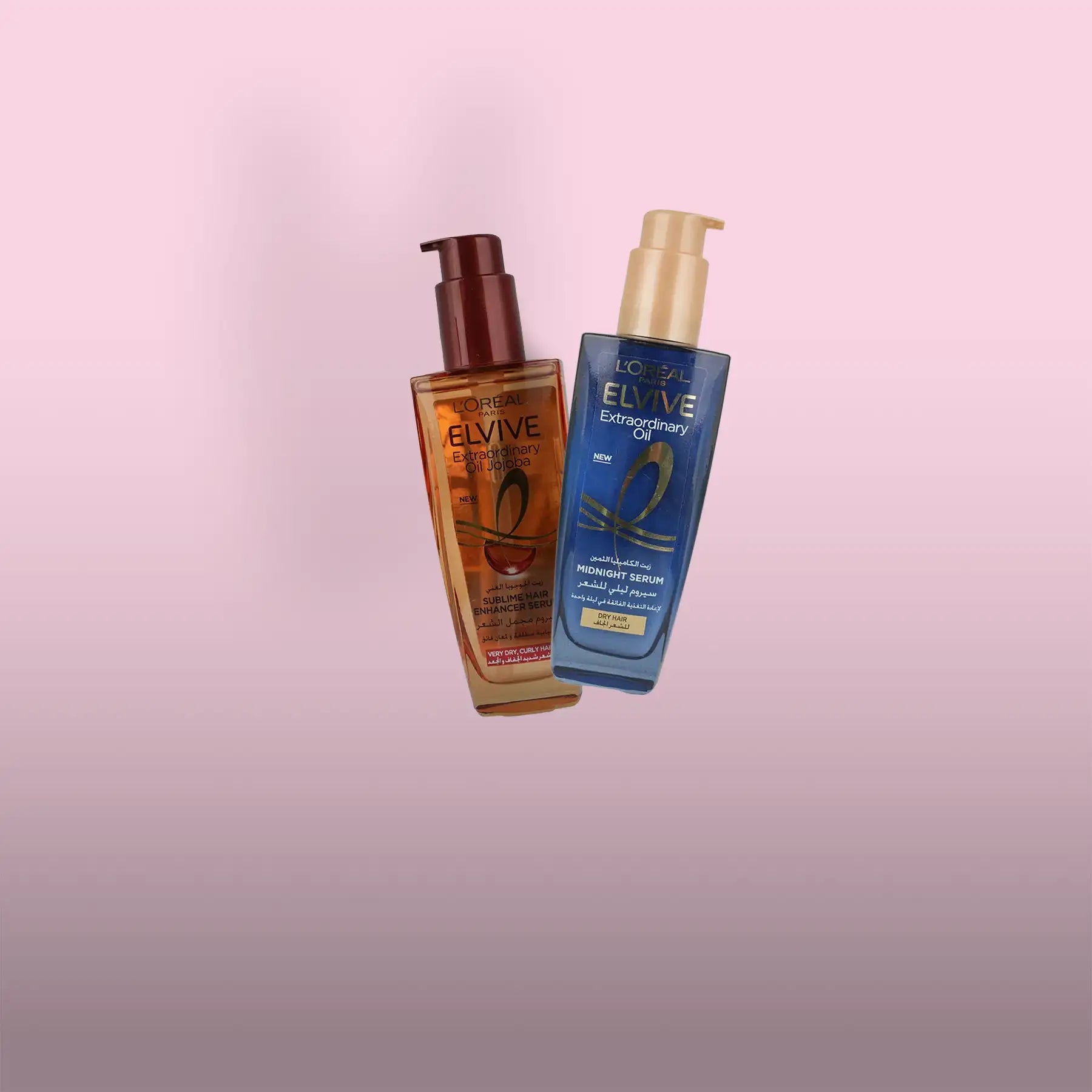 Two l’oréal elvive extraordinary oil hair care products, one amber glass bottle with a dark brown pump and the other blue plastic bottle with a gold pump.