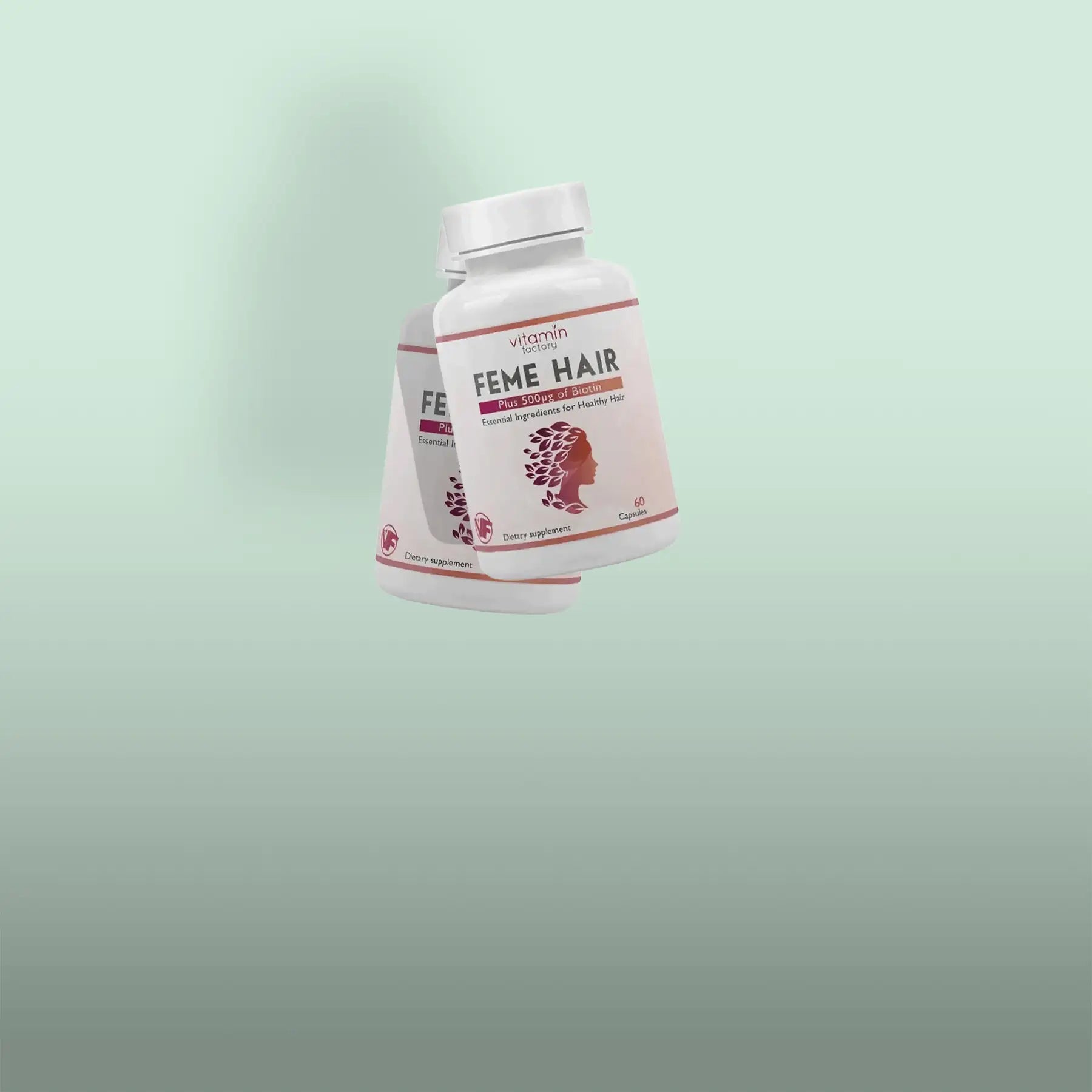 White plastic bottle of vitamin factory feme hair dietary supplement with pink and maroon labeling featuring a silhouette of a woman’s head adorned with hair.