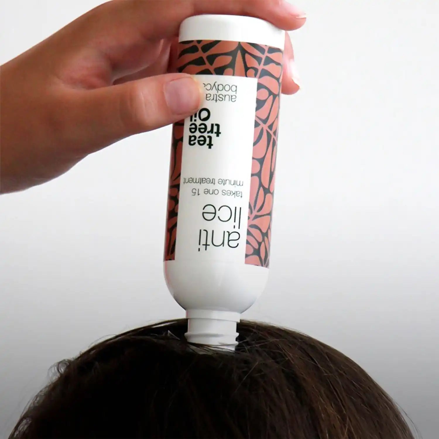 Tea tree anti-lice oil applied to hair