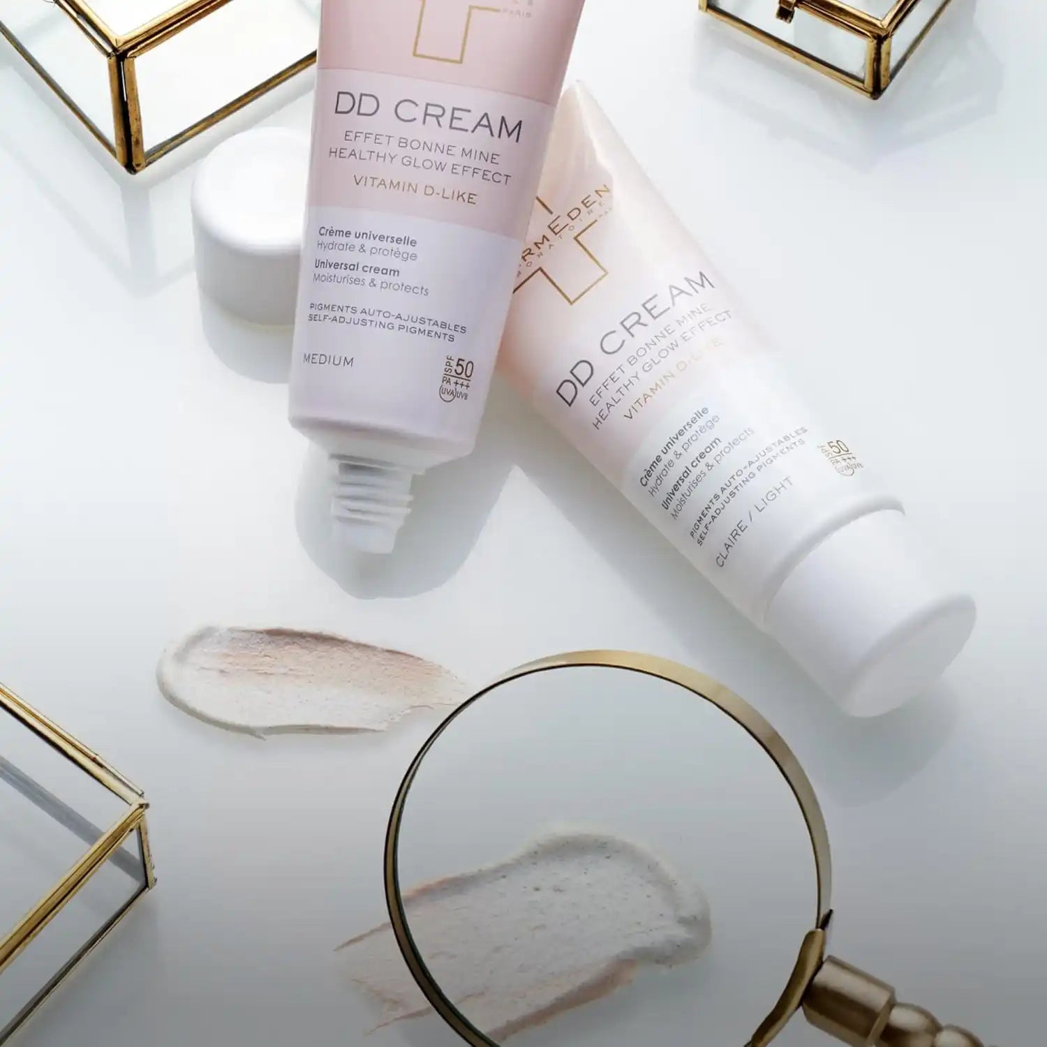 Two tubes of tinted facial cream with SPF 50.