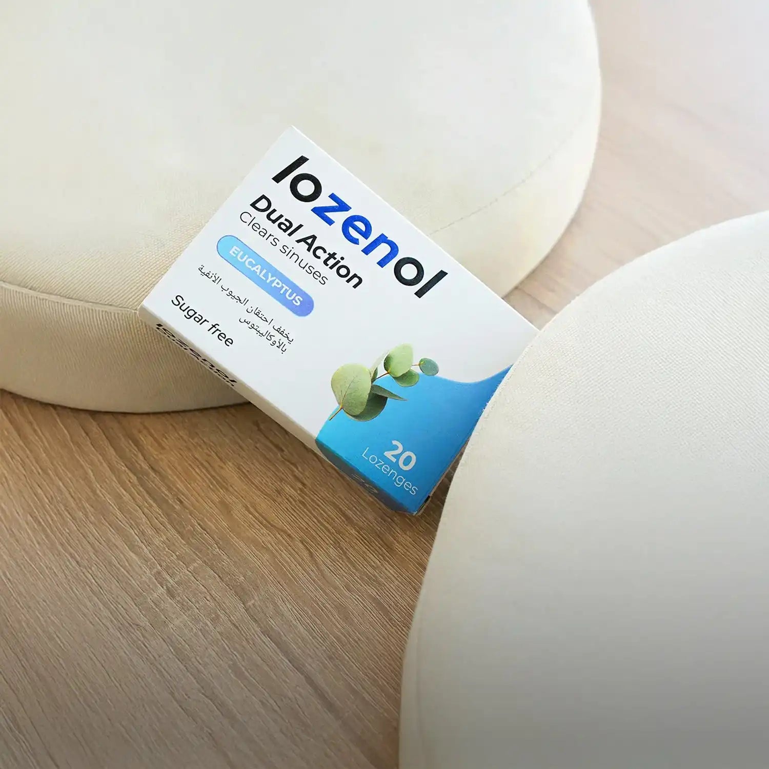 Lozenol dual-action sugar-free cough drops box, blue and white packaging with green leaves design.