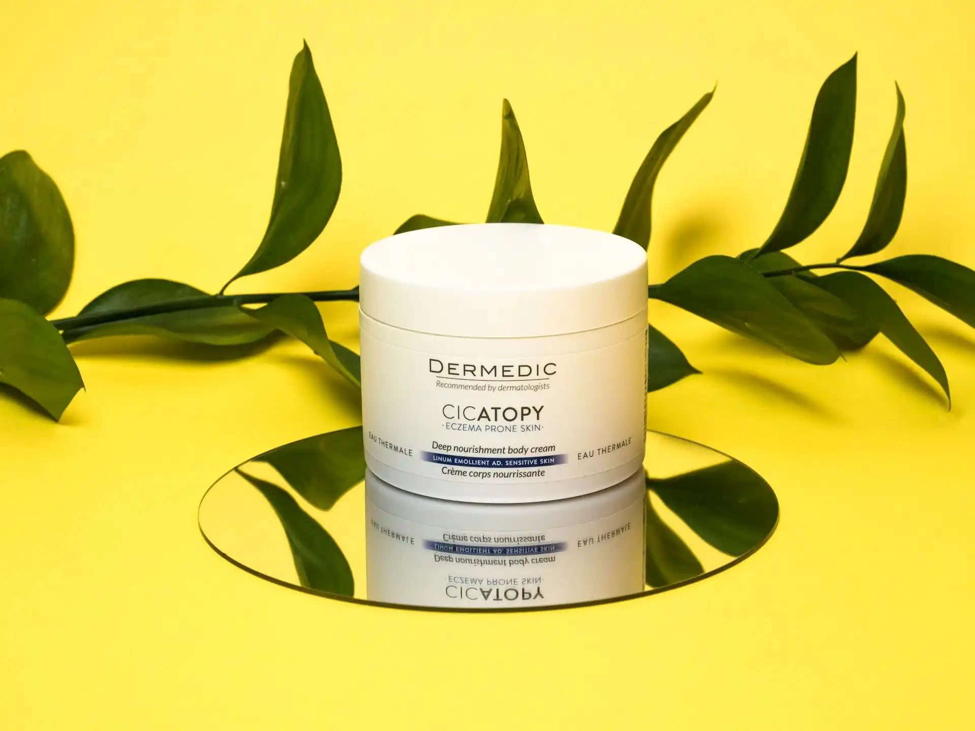 White jar of body cream.