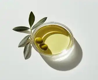 Olive oil in a clear dish.