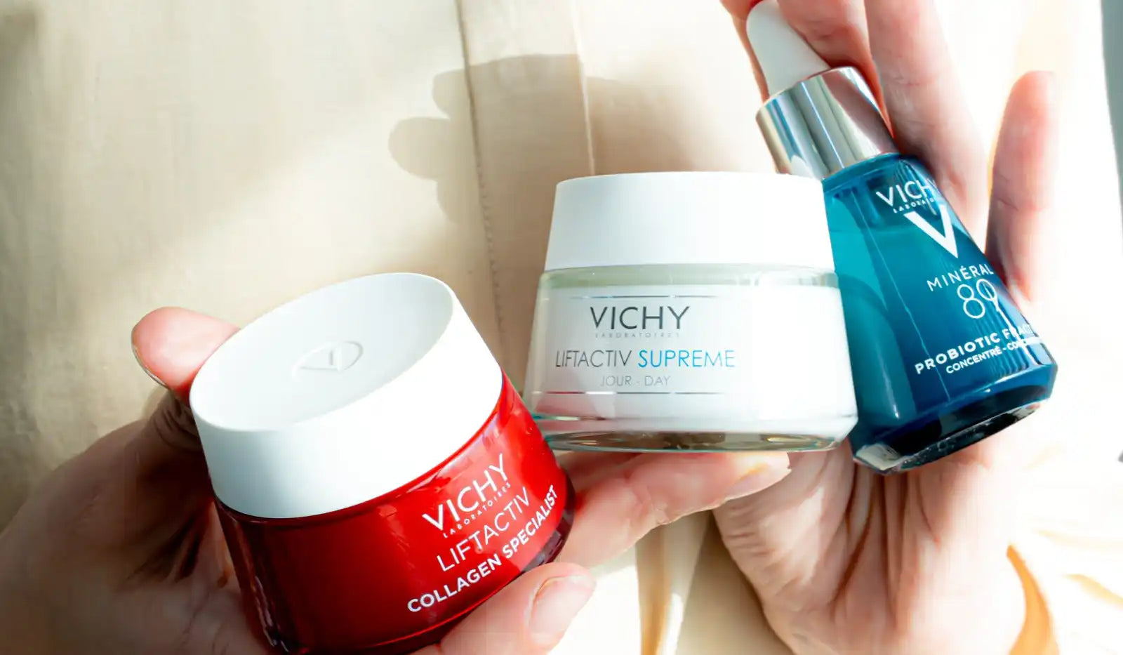 Three Vichy skincare products, including a red jar of Liftactiv Collagen Specialist, a white jar of Liftactiv Supreme, and a blue bottle of Mineral 89 Probiotic Fractions.