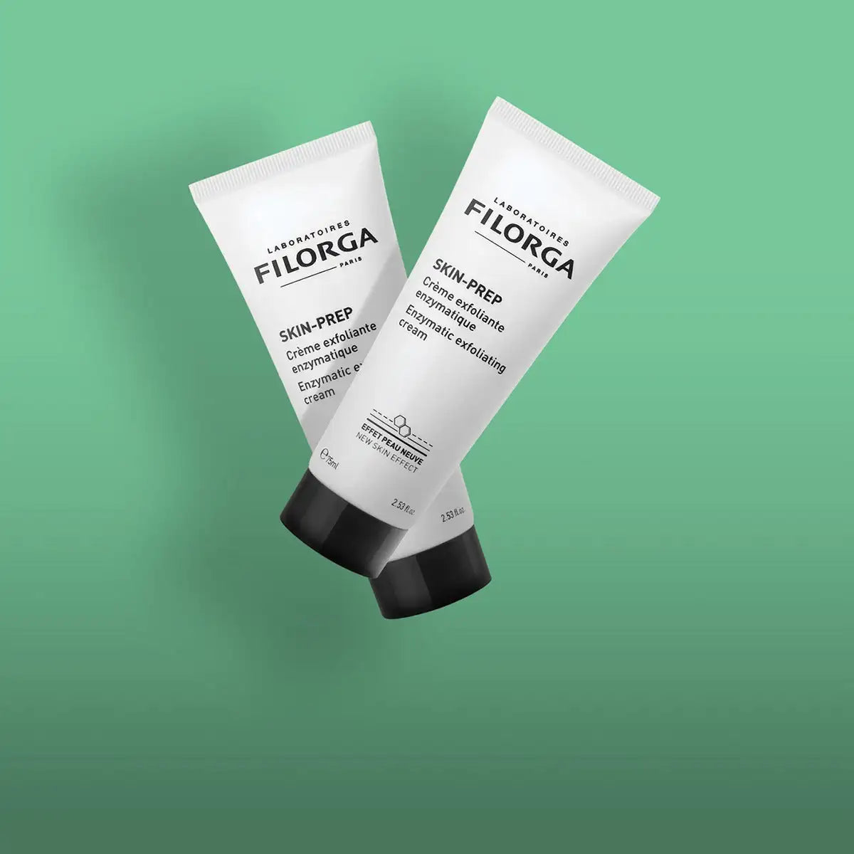 Two white filorga skin-prep enzymatic exfoliating cream tubes with black caps, featuring minimalist branding and multilingual labeling.